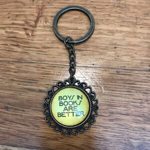 “Boys in books are better” brass Art Deco sunflower bottlecap keychain